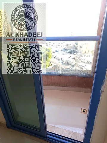 Large studio with balcony for sale, excellent investment opportunity in Al Nuaimiya Towers, Tower C, close to Al Hikma School, easy access to Dubai an
