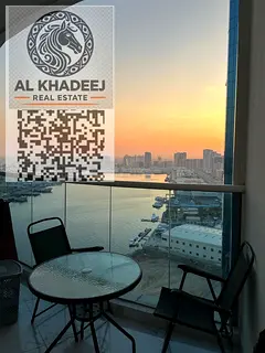 Great offers for annual rent in Al Waha Towers, two bedrooms and a hall with a maid's room, with a p