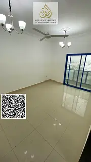 For annual rent in Ajman - Directly on Al Ittihad Street - Two bedrooms, separate living room, two b