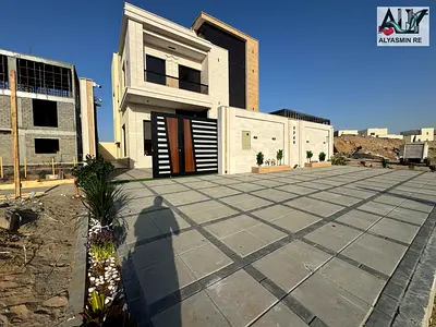 Villa for sale, including registration and ownership fees, on the main street, ready to move in, in one of the most prestigious areas of Ajman, freeho