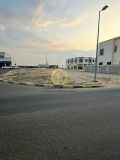 For sale: Corner commercial-front land in Sharjah, Al Houshi, Al Baidya suburb. Area: 6006 sq ft. Co