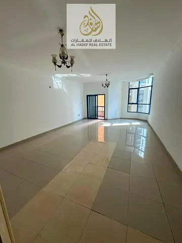 One of the largest apartments in Ajman, with three bedrooms, a living room, four bathrooms, two balconies, a maid's room, a laundry room, built-in war