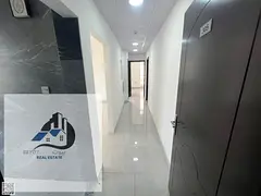 For annual rent in Ajman: Two bedrooms and a living room, brand new, first occupancy.