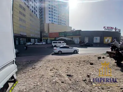 ارض سكني تجاري (G+8)في الراشيديه 1 عجمان  مقابل ابراج اللؤلؤه