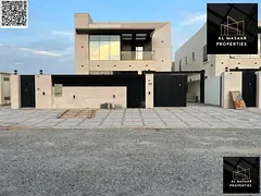 Luxury villa with a modern design, 5000 sq ft, with a garden, behind Ajman Academy. Price includes a