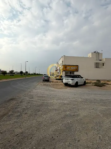 للبيع ارض زاويه تجاريه اماميه بالشارقه الحوشي ضاحيه البديع مساحه 6006 قدم زاويه علي شارعين 24 متر و12