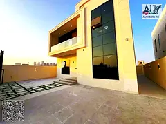 Located on Sheikh Mohammed Bin Zayed Road, next to Al Watan University, a 5-bedroom villa with a lan