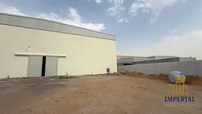A gated plot of land (43,000 sq ft) with a 7,000 sq ft warehouse and 70 kW of electricity is availab