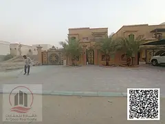 Villa for sale in Ajman, including electricity, water, and air conditioning. The villa is located on
