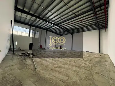 Warehouse for rent in Umm Al Thu'ub, suitable for commercial or industrial storage or a distribution center. The warehouse features a prime location w