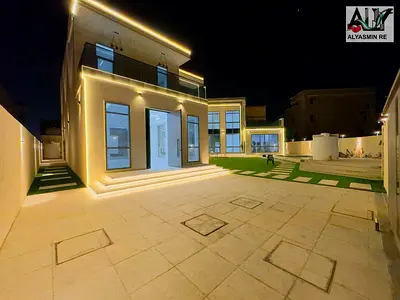 A luxury villa in the most prestigious area of ​​Ajman with a private pool, including electricity, water and air conditioning, for a sophisticated and