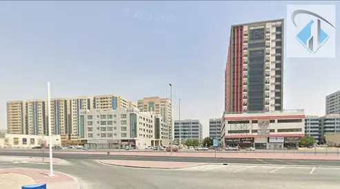 Residential and commercial land in Al Hamidiyah 1, freehold ownership for all nationalities, directly on Sheikh Ammar Bin Humaid Street, G+12