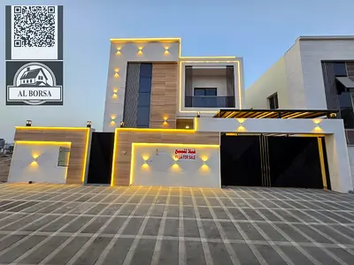 Villa for sale in Al Bahia, Ajman. 5 master bedrooms, large majlis, large living room, kitchen, maid's room.