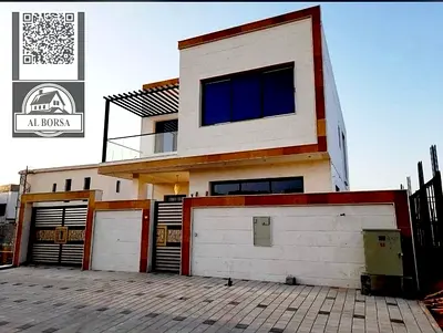 For sale, a luxurious villa in Al Yasmeen, Ajman, 5 master bedrooms, a living room, a hall, and a maid's room - at a special price, located in a strat