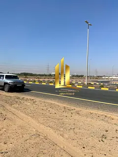Land for sale in Al Sajaa Industrial, 22,900 sq. ft., freehold for all nationalities, ready for cons