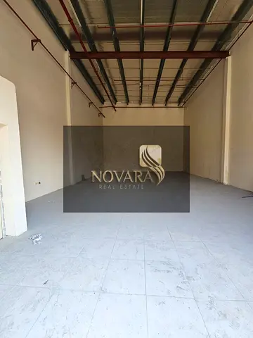 2000 sqft warehouse in Al Jurf Ind. 1 on main road, no mezzanine, 25 kW power, l —perfect location for your business.