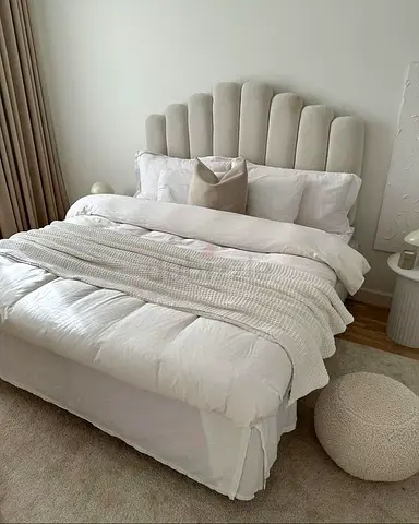 Elegant White Bed with Soft Textiles