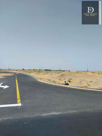 For sale in Sharjah, Muzayra’a area, Al Rahmaniya suburb, residential land with an area of ​​3444 feet, a residential villa permit, ground floor and