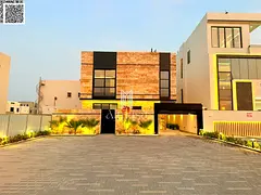 A luxurious, modern villa with a full stone facade and an exceptionally opulent interior featuring h