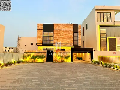 A luxurious, modern villa with a full stone facade and an exceptionally opulent interior featuring high-end hotel-style finishes, including registrati