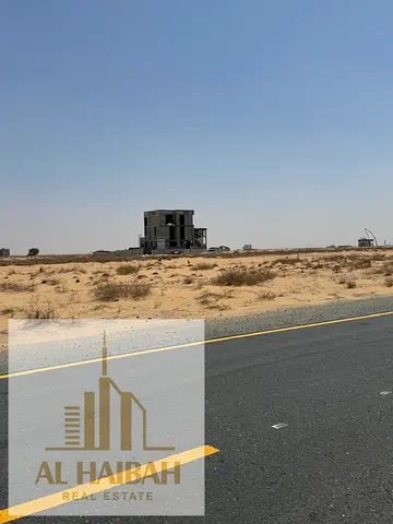 Two residential plots for sale in Sharjah, Rawdat Al Qurt area, on a wide 97-meter street opposite Al Suyoh 16, Oman Street. A truly prime location!