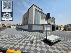 For sale, a villa in Al Rawda 2, Ajman, 5 bedrooms, a living room, two halls, a kitchen with a maid&