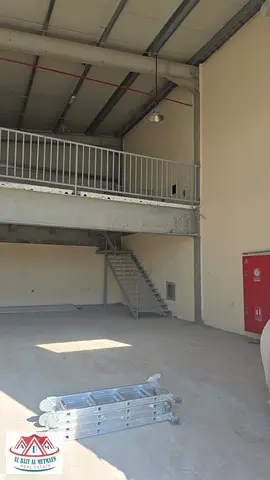 Industrial building in Al Sajaa S, with storage and enclosure.