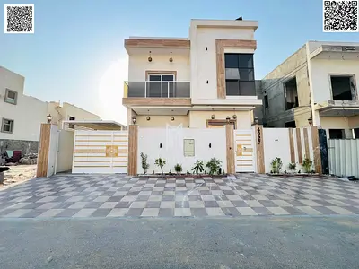 Luxury villa for sale in Al Zahia – Ajman. Super deluxe custom finishing. Prime location on a main road. Includes water and electricity. Freehold owne