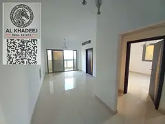 Two bedrooms and a spacious living room with a balcony offering an open view, located in the Al-Aliy