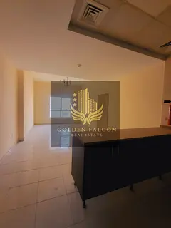 Spacious 2BHK apartment with a large balcony and podium view in Emirates City, Ajman — perfect for