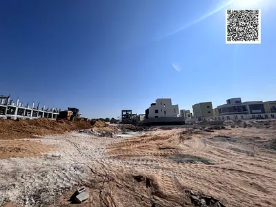 Two adjacent plots of land for sale in Ajman, one on a street and the other on a street and alley. Located in Al Helio 1 area. Residential villa permi