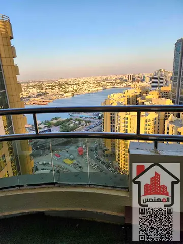 Apartment for sale in Ajman, Horizon Towers, fully furnished, 2 bedrooms, maid's room, living room, 3 bathrooms, spacious kitchen, high floor, creek view for all rooms. Asking price: AED 500,000