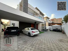 Villa for sale in Ajman Al Rawda, featuring 5 master bedrooms, a majlis (formal sitting room), a liv