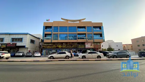 A building for sale in Al Mowaihat 1 with a spacious area and high income.