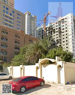 For sale in Ajman, Al Rashidiya 3, residential/commercial plot (G+6), corner lot on a paved road, la