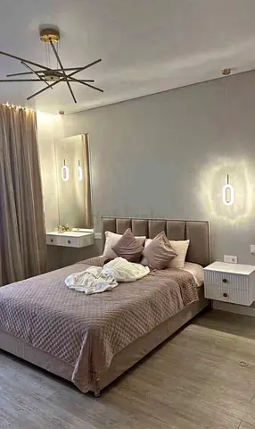 Elegant Bed with Nightstands and Modern Lighting