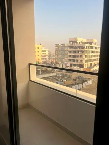 For rent first tenant 1 bedroom apartment in Muwaileh Commercial near Aljada, 2 bathrooms, balcony with open view and central AC.