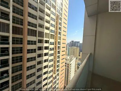 2-bedroom apartment for rent in Ajman One Towers, annual contract, four payments, security deposit by cheque.
