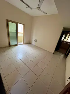 Bedroom and living room in Al Naba’ah, family only, balcony, central AC and gas, rent AED 25,000,