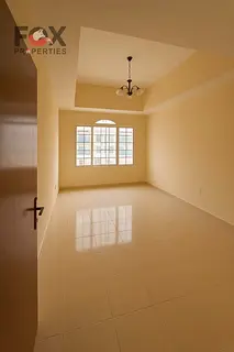 Uptown villa for annual rent: 3 bedrooms, living room, majlis, balcony, parking, and 3 bathrooms. Lo