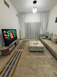 For rent in Ajman, first tenant, Al Nuaimia, next to Han Cafe. Two bedrooms and a living room with a