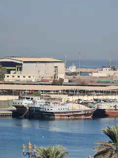 Two rooms and a hall in Al-Shuhain with a sea view, split air conditioning, spacious areas, a very c