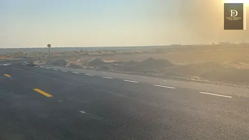 For sale in Sharjah Mizraa area Residential investment plot of land, area 3724 feet Very distinguished location, corner on two streets, 18 meters