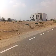 Residential Land for Sale – Al Muzairah | Prime Location Facing the Park