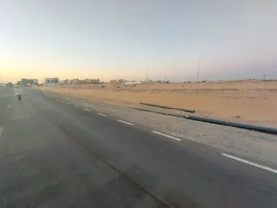 Two adjacent plots of land for sale in Al Sajaa Industrial Area
