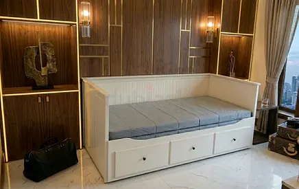 Elegant Daybed: Clean panel finish with comfortable mattress and deep pull-out drawers.