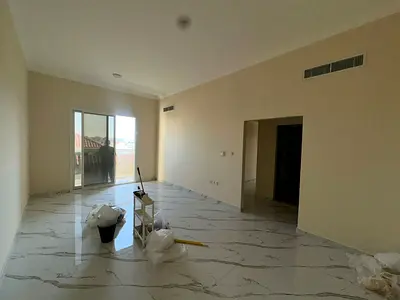 Two bedrooms and a living room in Al Muwaihat 3, first occupancy, on the main street next to Ajman Academy and close to Mohammed Bin Zayed exit