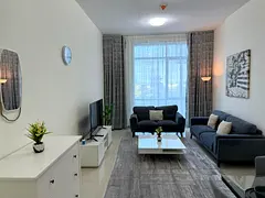 Furnished one-bedroom apartment with hotel-style furniture and a sea view for monthly rent in a prim