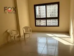 Two-Bedroom Apartment with Living Room for Annual Rent in Emirates City, Garden View, Free Parking,