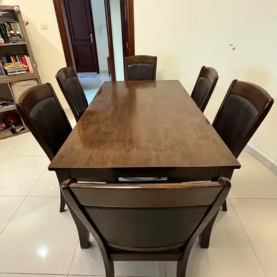 Wooden Dining Table with 6 Chairs are in good condition